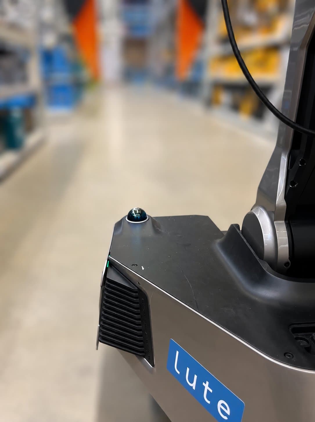 Lute robot navigating a retail warehouse aisle